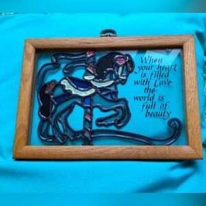 Carousel horse painting on glass with a written saying.